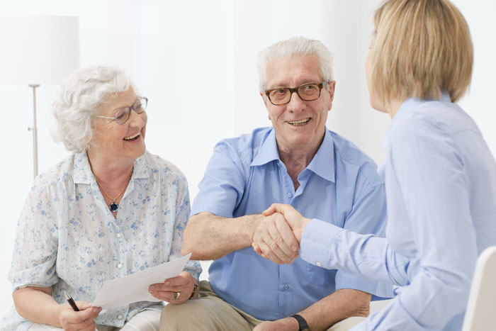 Older couple happy about receiving hearing aids